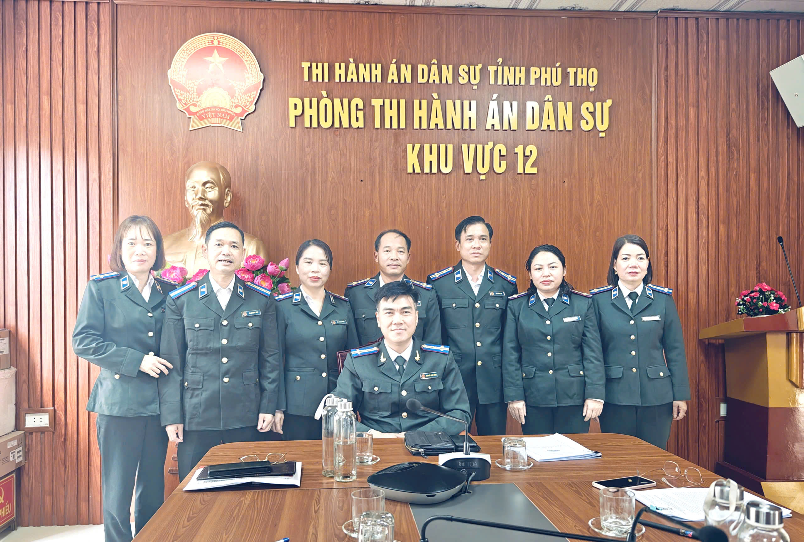 A group of people in military uniforms at a tableAI-generated content may be incorrect.